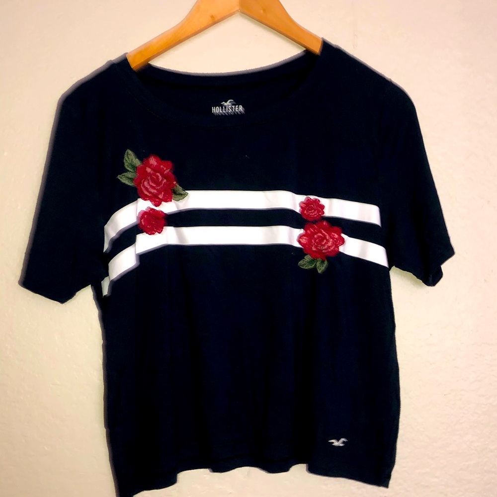 Red, white, and blue striped shirt with flowers